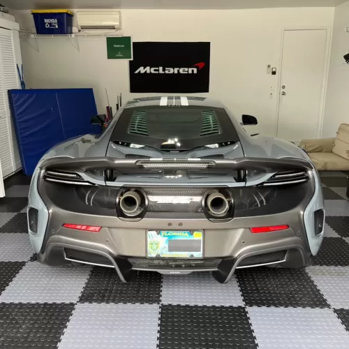 Coin Top Garage Floor Tiles Black and Gray with McLaren Parked On Them