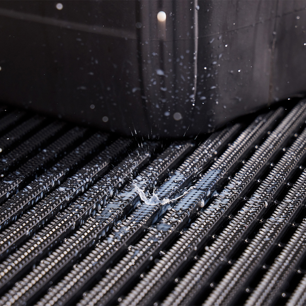 close up of liquid dripping on Flexigrid Industrial Matting 