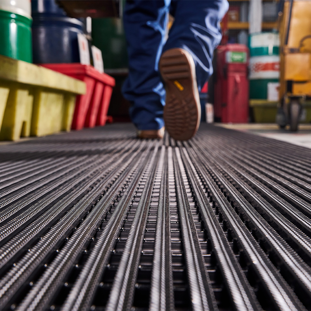 person walking on Flexigrid Industrial Matting 3 x 16.5 ft Roll 