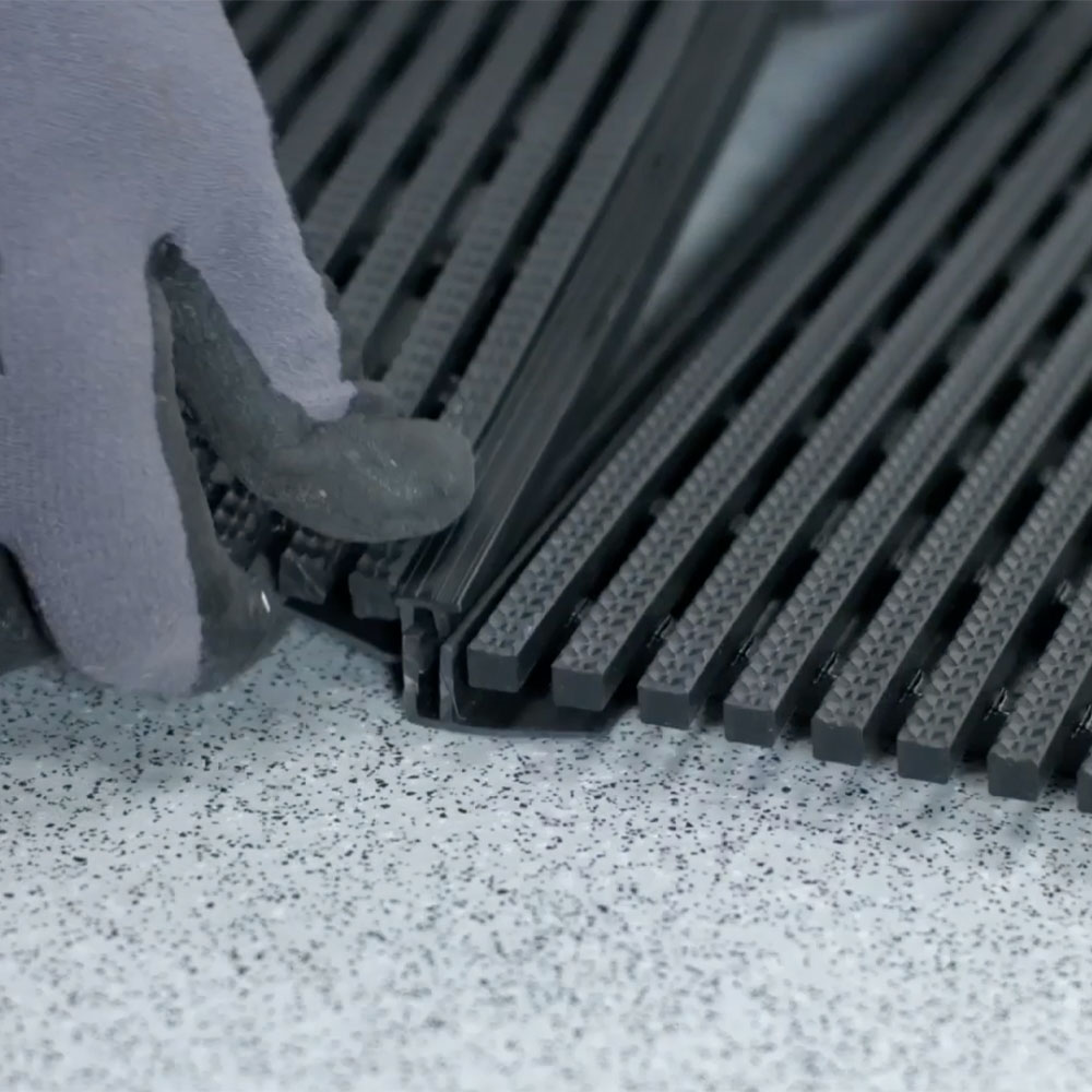 Connecting two mats with the Snap Track Joining Strip