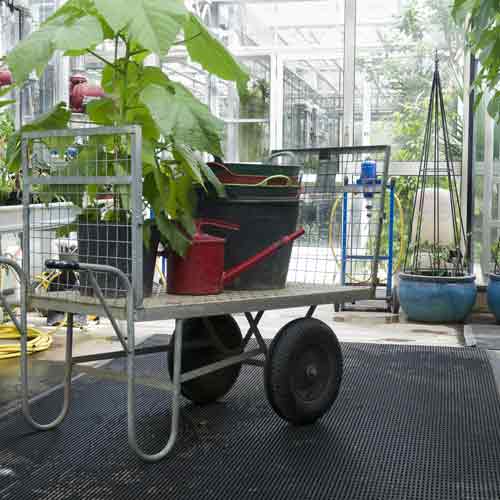 black greenhouse floor mats in commercial greenhouse