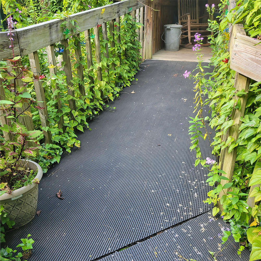 vynagrip pvc matting on outdoor wood wheelchair ramp in a garden setting
