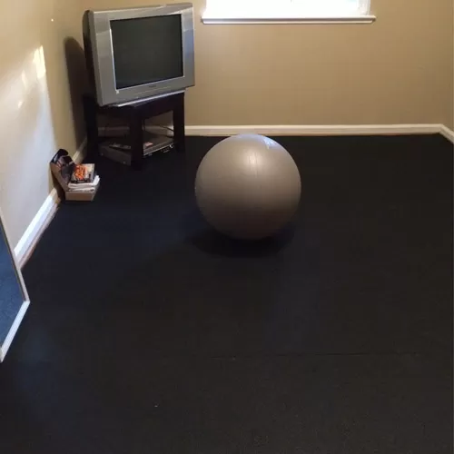 Plyometric Roll 3/8 inch 4x10 ft Black workout room.