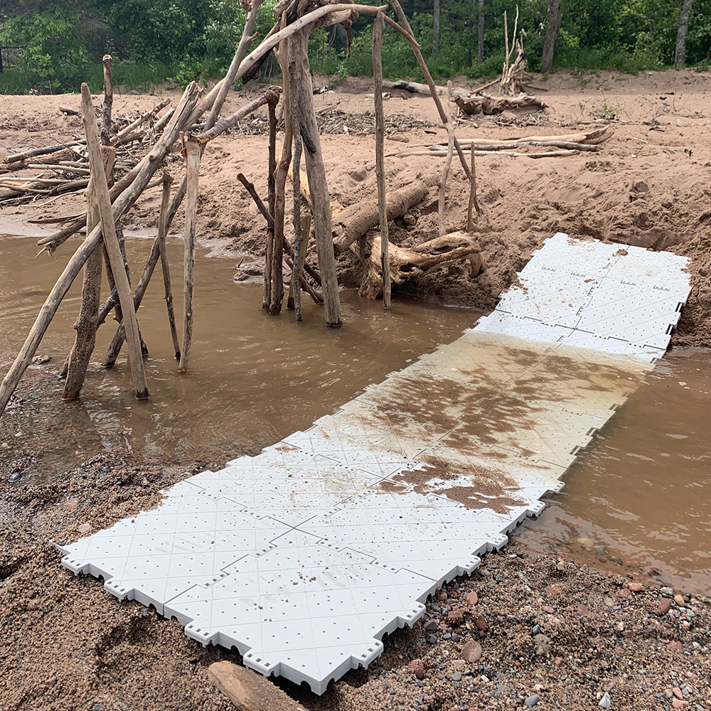 Portable Outdoor Tile being Used on the Beach Path over sand