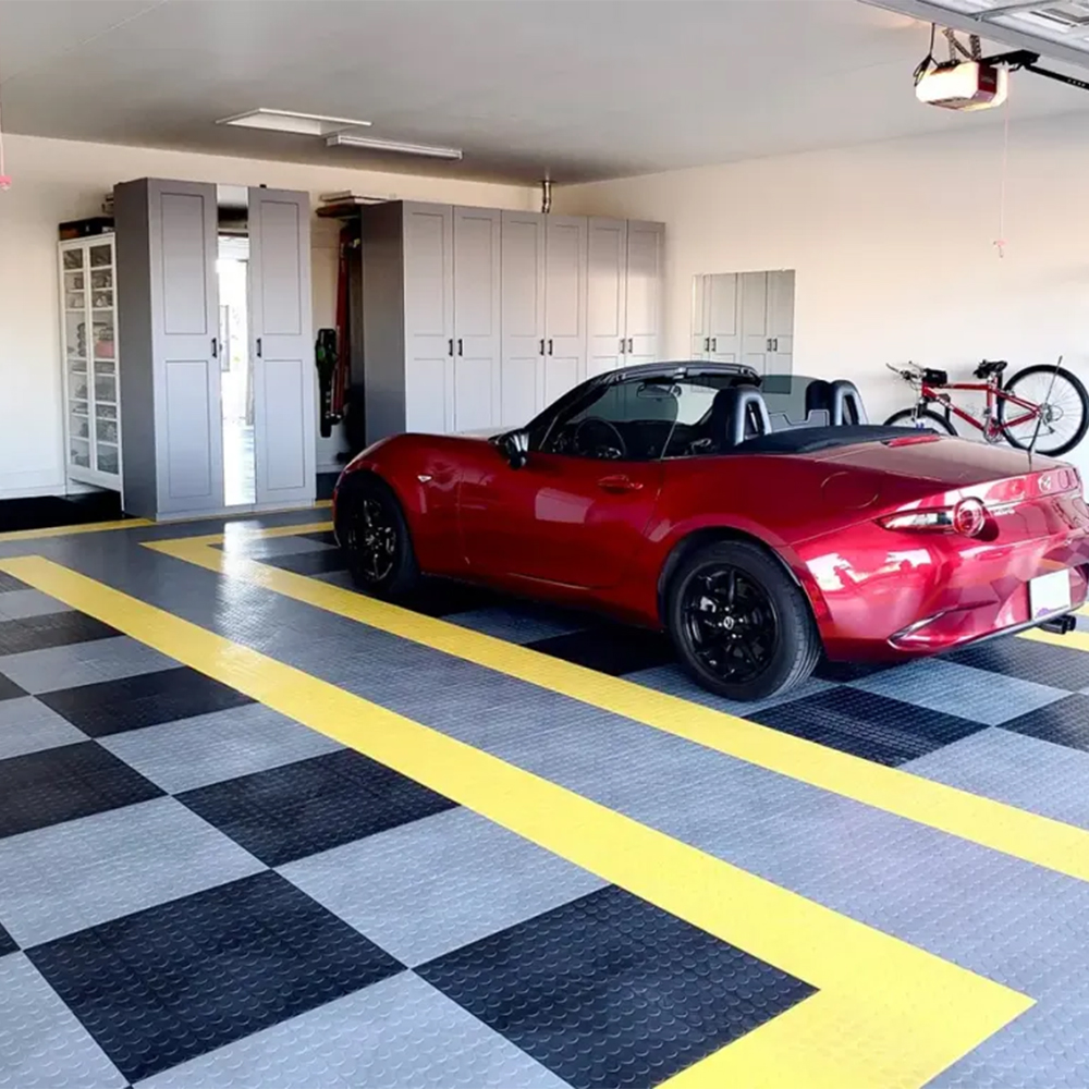 RaceDeck CircleTrac Garage Floor Tiles 1/2 Inch x 1x1 Ft. Mazda car on Alloy, Black and Yellow tiles