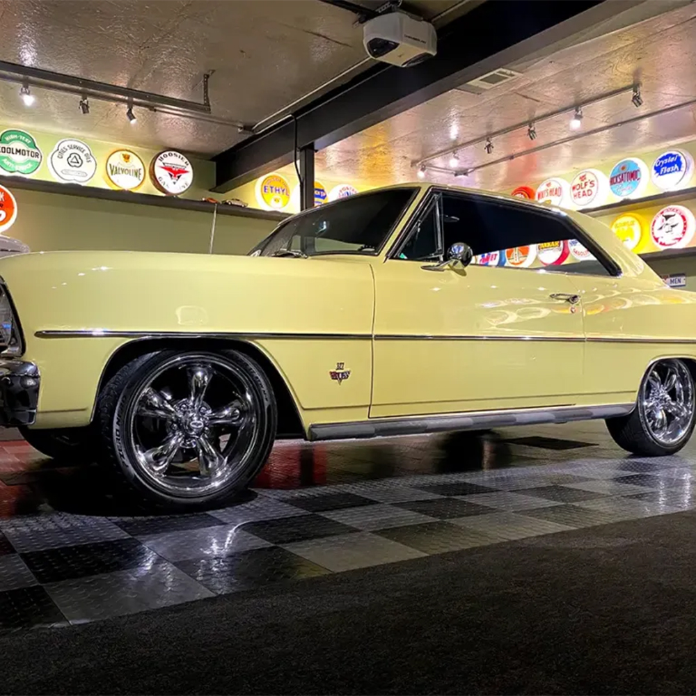 RaceDeck CircleTrac Garage Floor Tiles 1/2 Inch x 1x1 Ft. Black and Graphite tiles with Nova parked