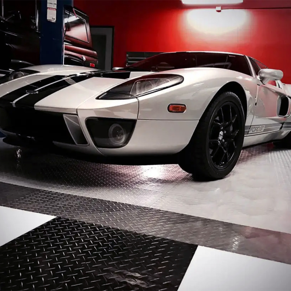 RaceDeck Diamond TuffShield Garage Floor Tile 1/2 Inch x 1x1 Ft. Ford GT on alloy, black, graphite and white tiles