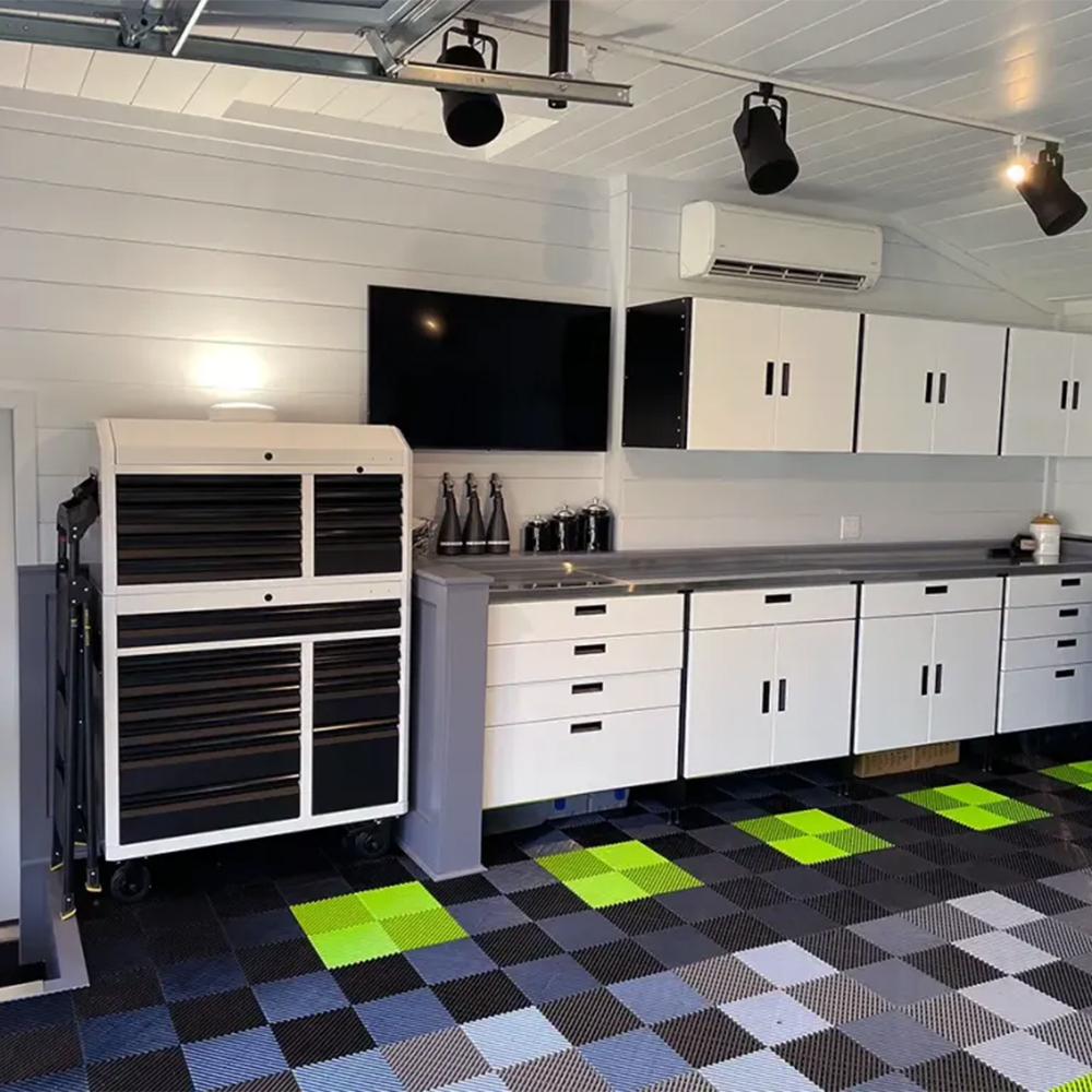 garage workshop with RaceDeck Free-Flow Garage tiles installed in the colors black, sublime green, and gray