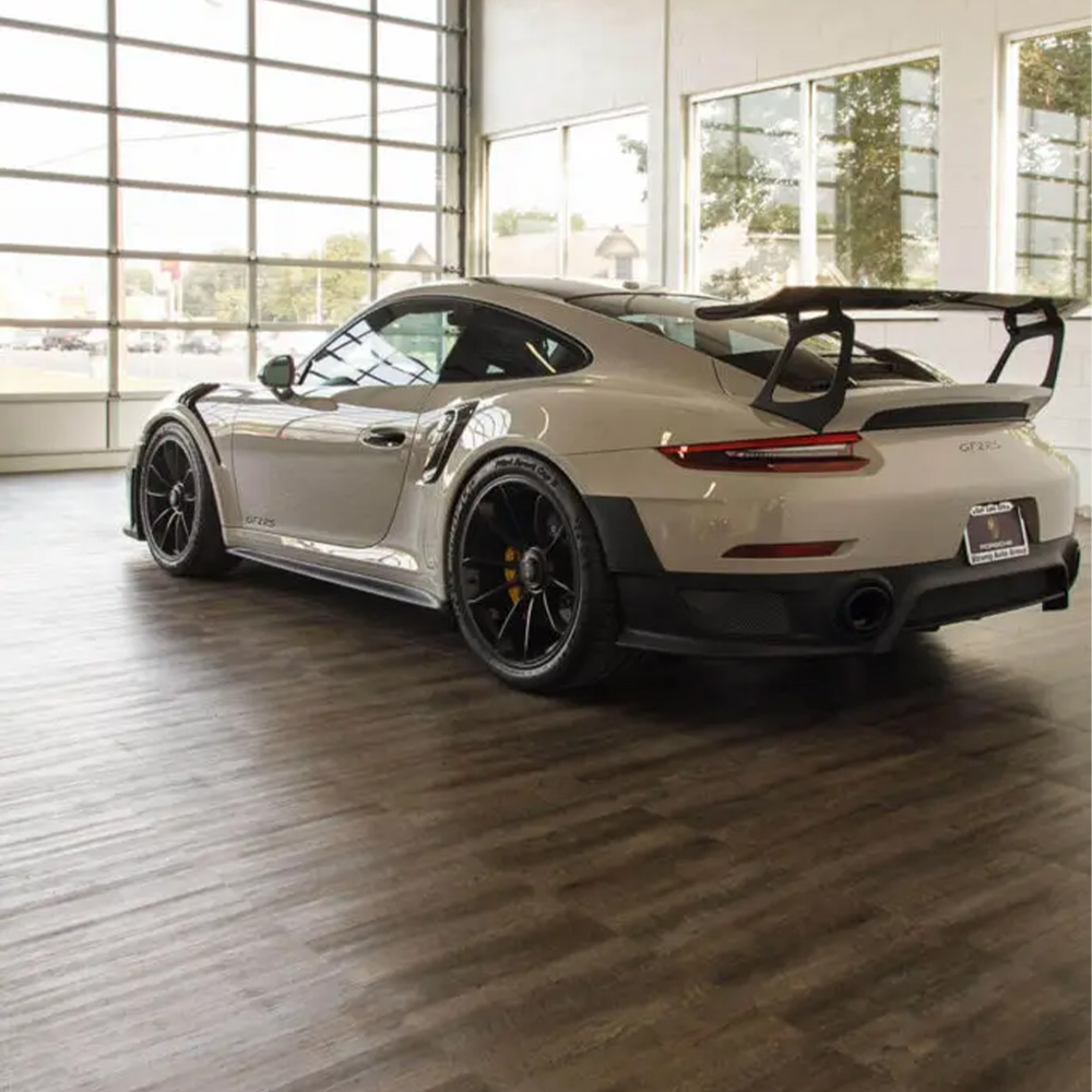 RaceDeck Oak Garage Floor Tiles 1/2 Inch x 18x18 Inches in garage with porsche
