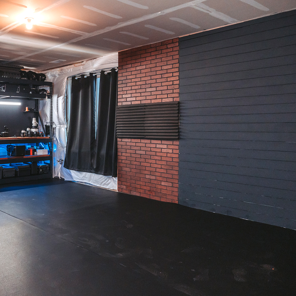 rolled rubber flooring in a photo studio room showing a brick wall backdrop