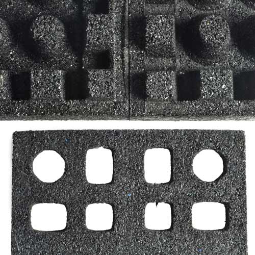 Bottom of two rubber dBTiles and and the Quad Blok
