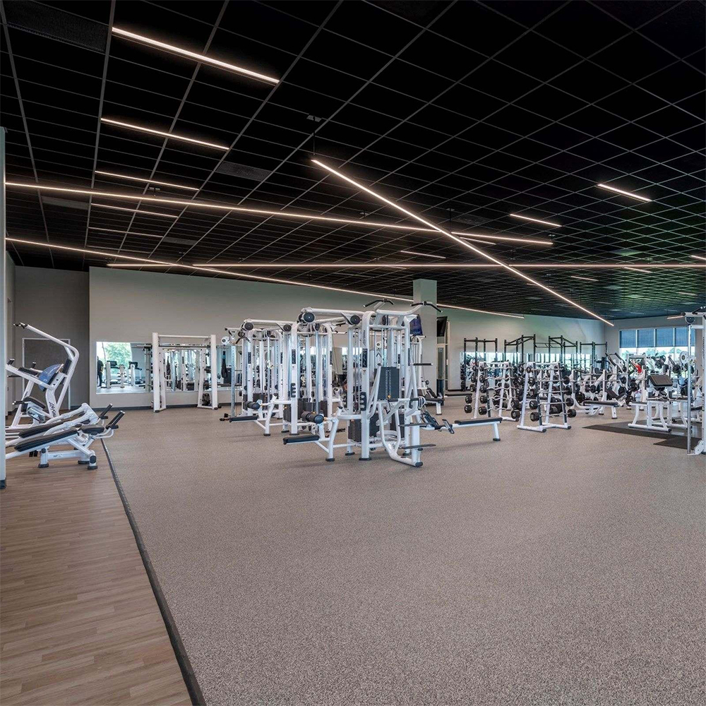 Rubber Gym Flooring Square Tiles Domination 38 x 38 Inch x 12mm grit gray installed in large fitness center