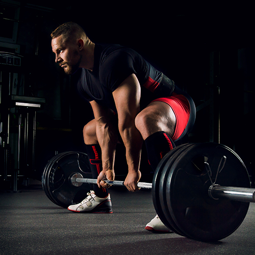 Man deadlifting on 1/2 thick rolled rubber flooring