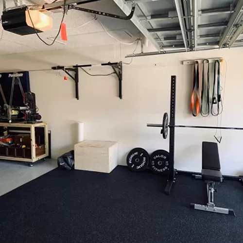 10 ft rubber floor mats in garage with gym equipment