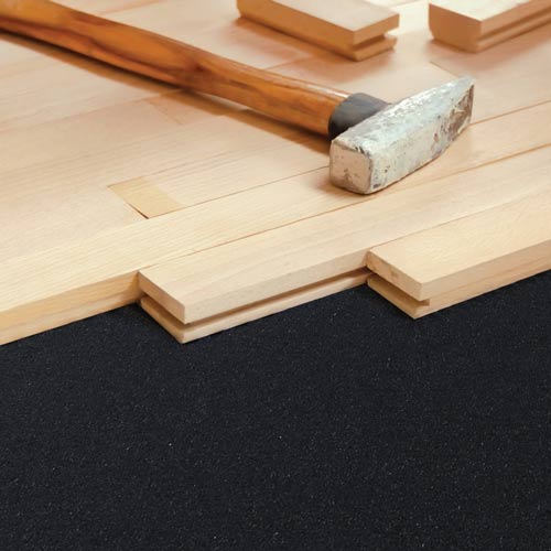 wood flooring installation over rubber flooring underlayment