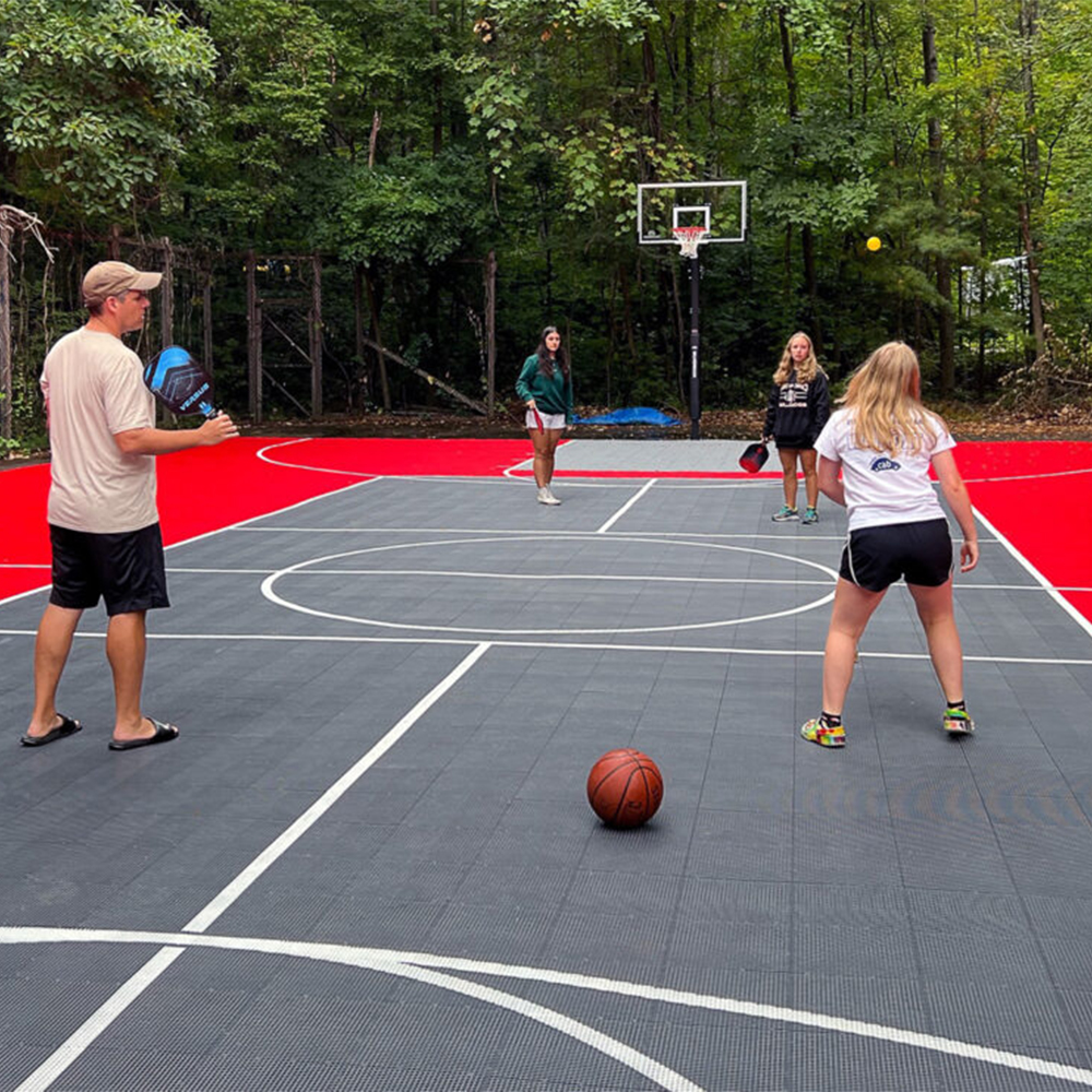 DunkStar BaseCourt Outdoor Tile with Lines 30x60 Ft. bright red and graphite with family playing pickleball
