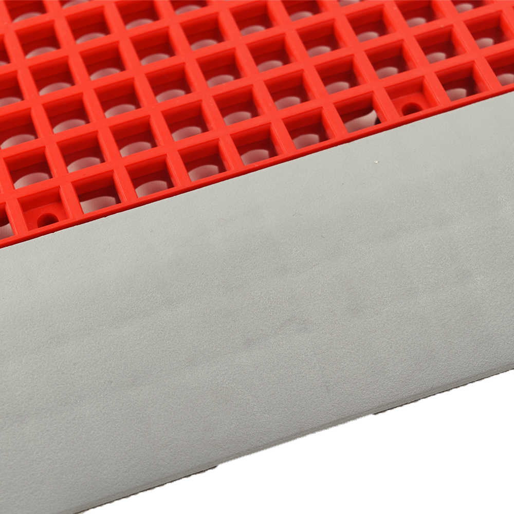 Close up of DunkStar BaseCourt Outdoor Corner Edge Borders Gray 5/8 In x 2 Inches Wide and bright red tile