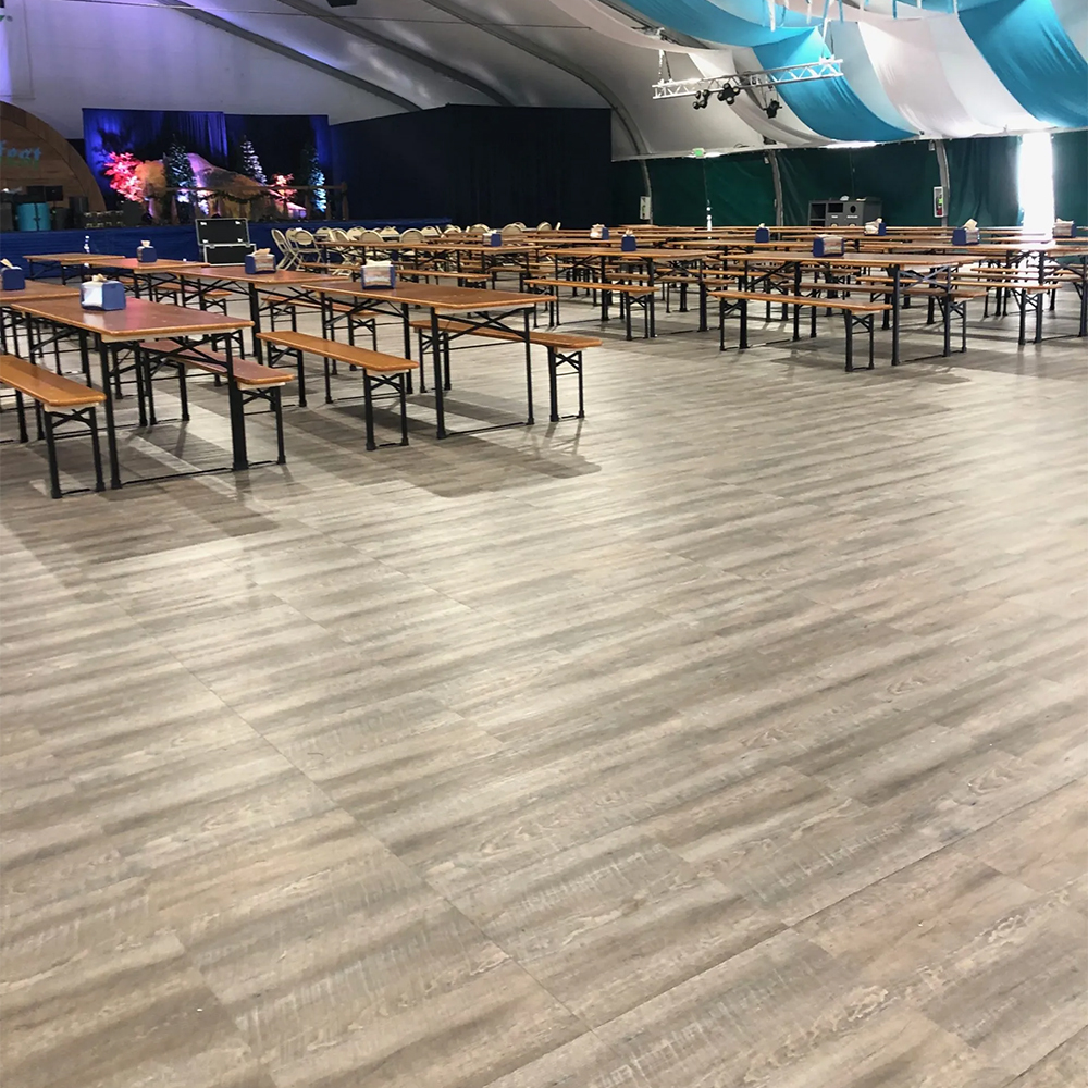 SnapLock Dance Floor XL Premium Tiles 1/2 Inch x 18x18 Inches Smoked Oak in tent with tables