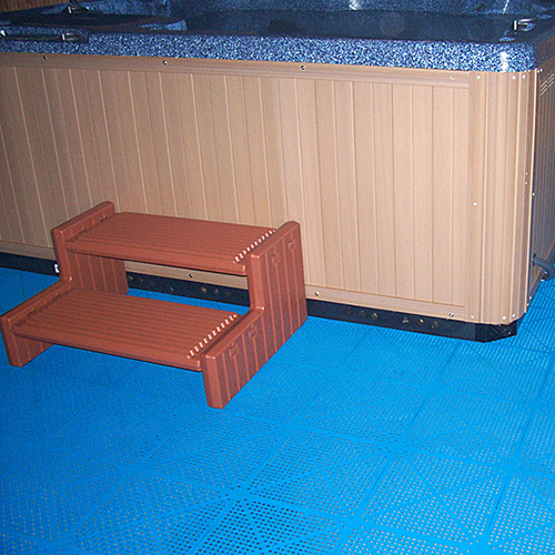 perforated blue tile installed around hot tub