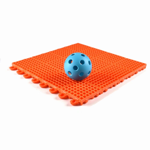 pickleball court floor tiles with ball