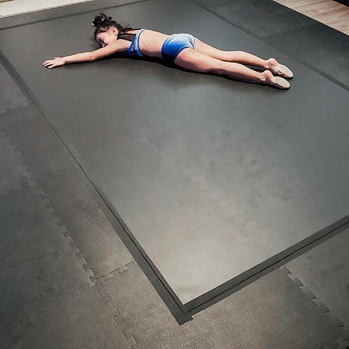 black foam mats used for cushioned underlayment for dance flooring