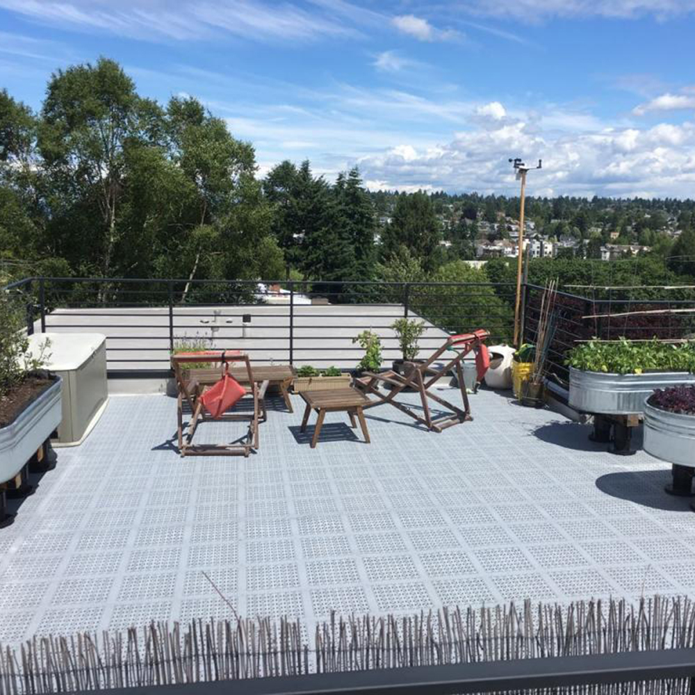 rooftop garden with staylock perforated tiles in gray color on floor
