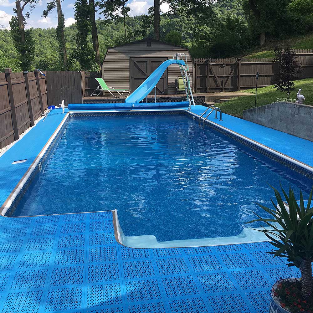 blue staylock perforated tiles installed around outdoor home pool deck