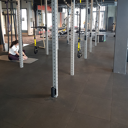 rubber floor tiles in a commercial gym space