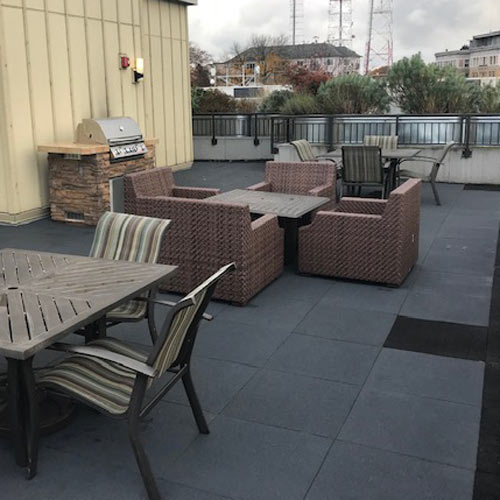 https://www.greatmats.com/images/sterling-rubber-tiles/sterling-roof-top-patio-install.jpg