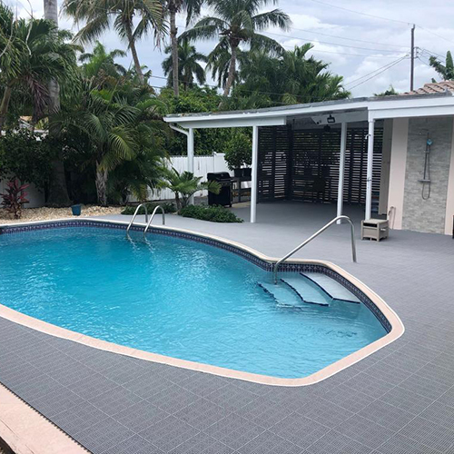 outdoor deck tiles used by pool