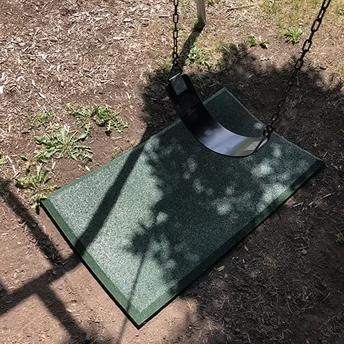 Green Swing Set Mat on Playground