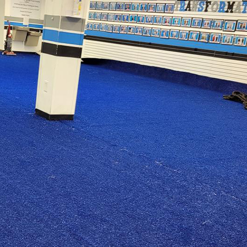 blue colored turf in gym setting