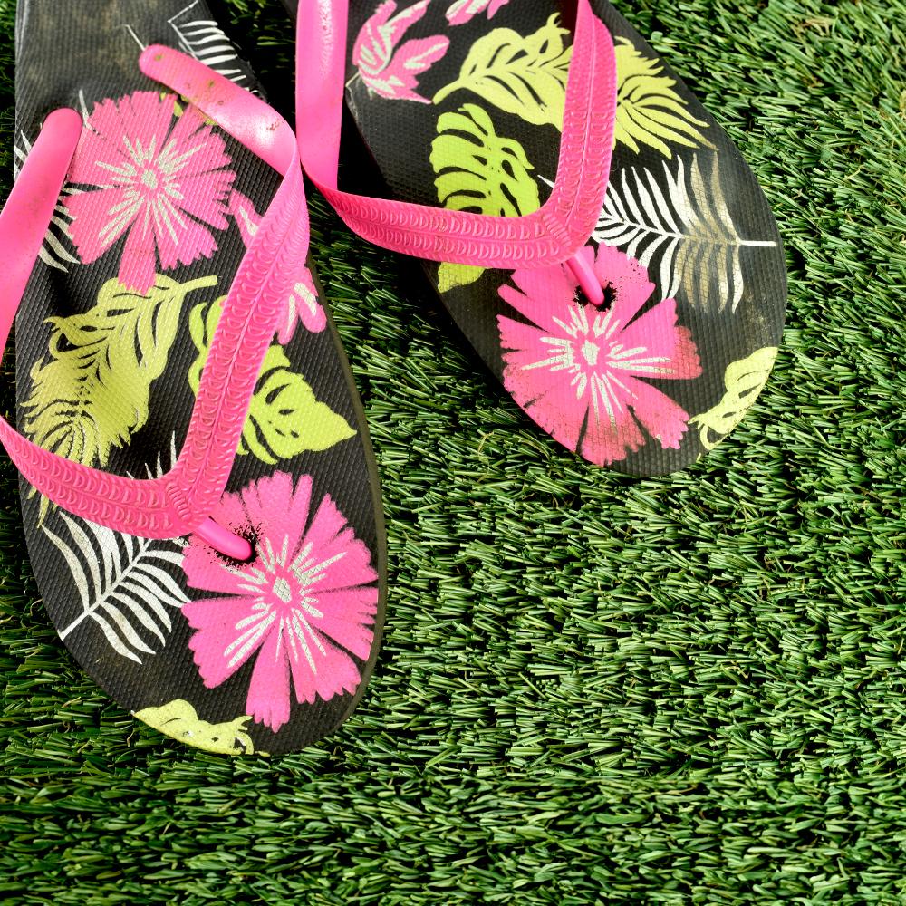 Greatmats Select Landscape Turf top view with flip flop sandals