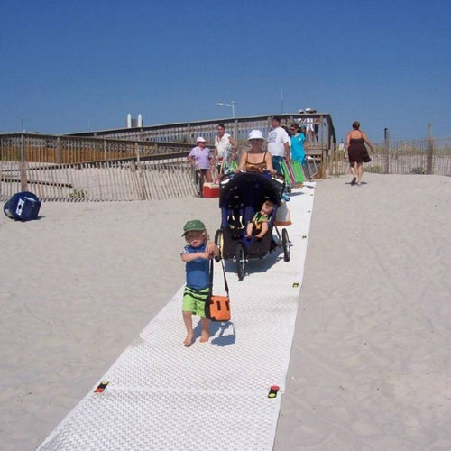 people walking on versamats as a beach walkway