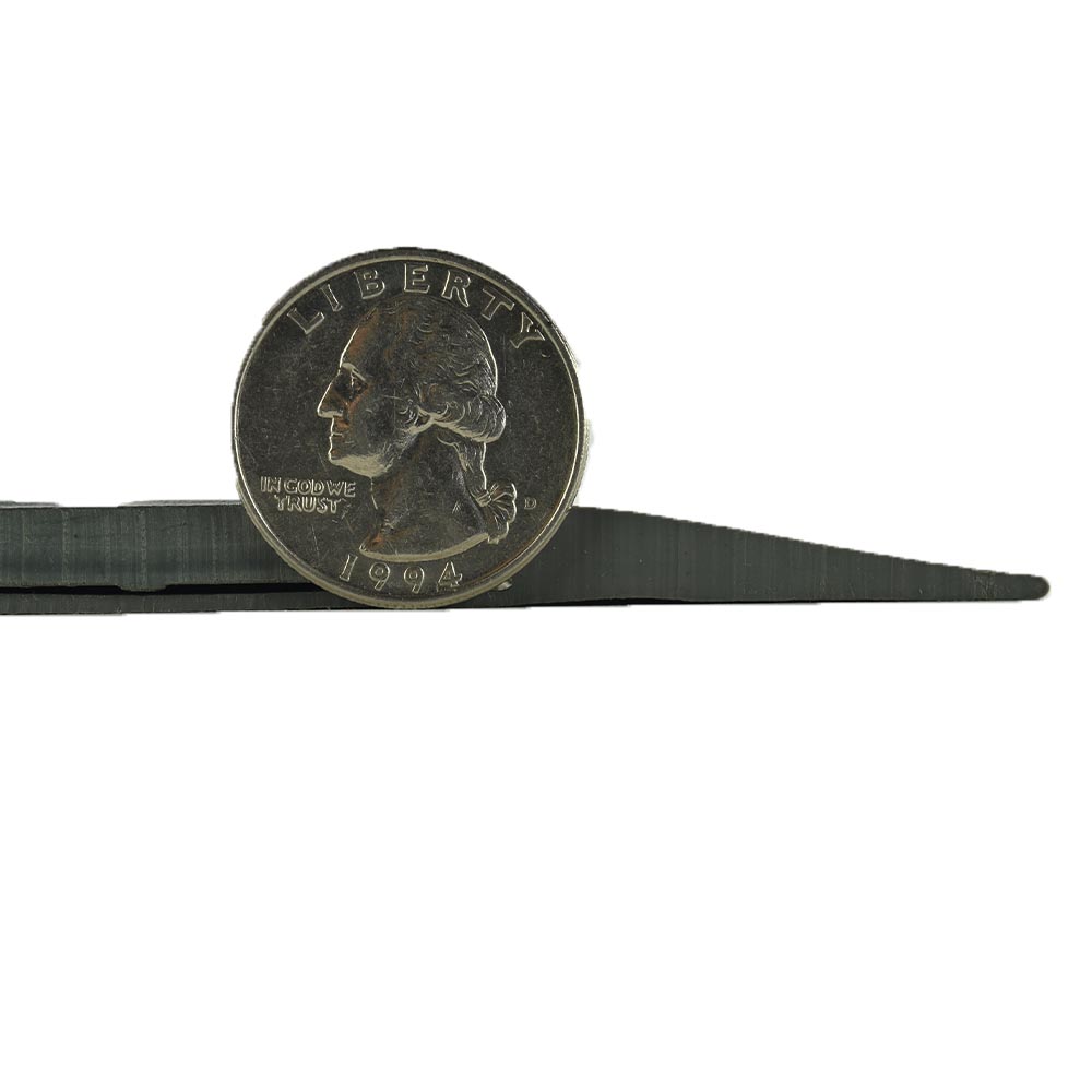 Close up Tuff Seal Reducer Strip per LF thickness compared to a quarter 