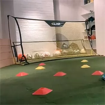 playing soccer in basement with artificial grass turf tiles