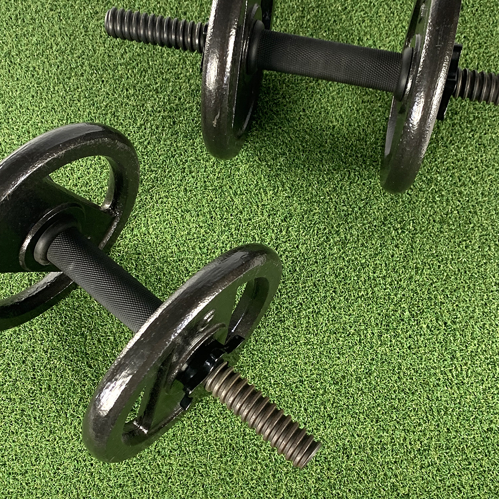 Thick padded gym turf tile with weights top view