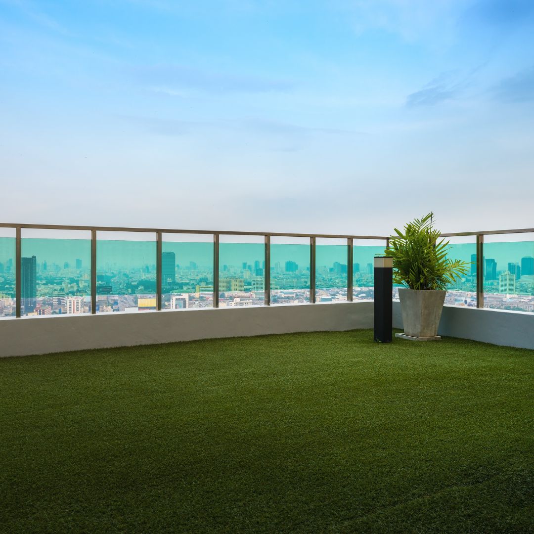 rooftop deck in city with artificial turf flooring