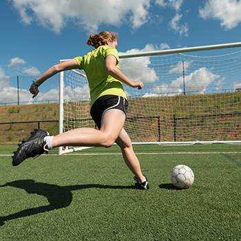 outdoor artificial soccer turf with player