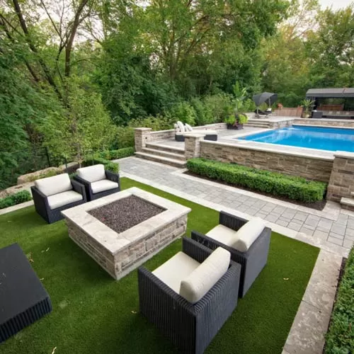 artificial grass turf in backyard with pool and lawn furniture