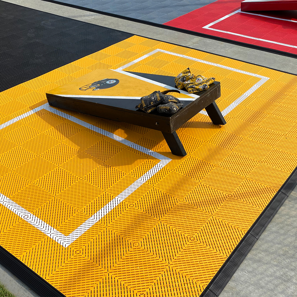 VersaCourt Active Outdoor Court Tile 5/8 Inch 15.75x15.75 Inches close up yellow tile cornhole board