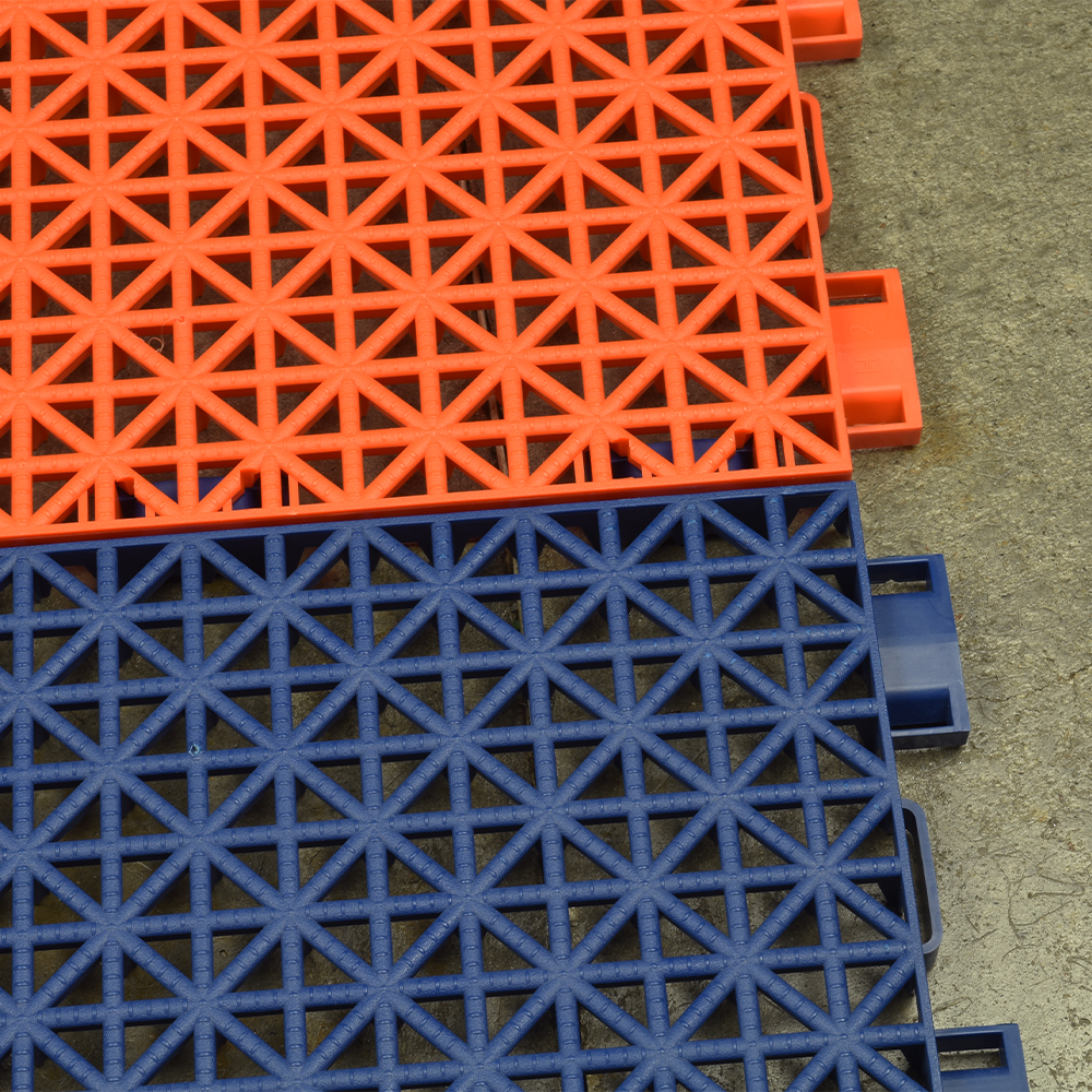 VersaCourt Outdoor Game Court Tile 3/4 Inch x 10x10 Inches close up of two tiles interlocked over concrete