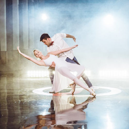 dancer performance on black theater stage flooring