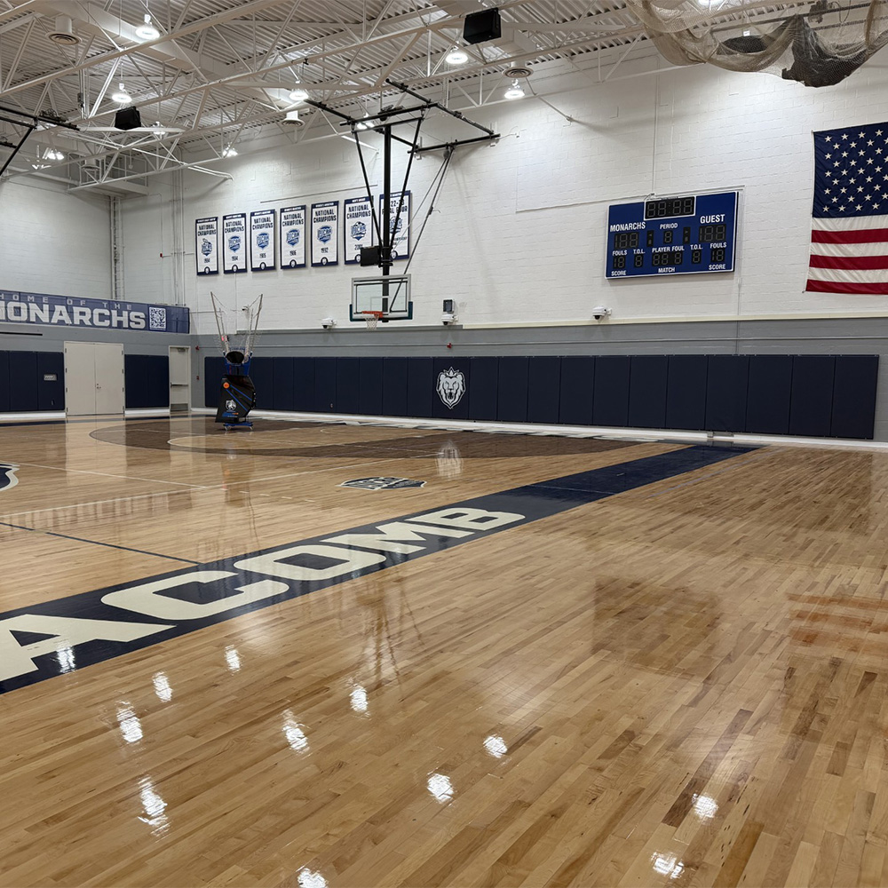 Navy blue wall pads in gym of Safety Fire Rated Impact Wall Pad 2 Inch x 2x7 Ft. Lip TB