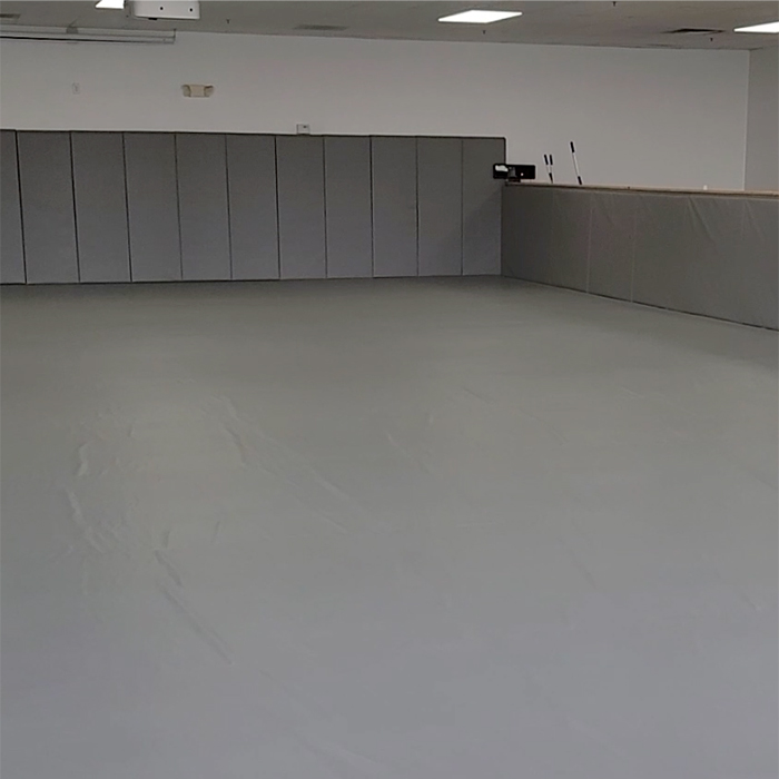 jiu jitsu studio for kids training with gray padded walls