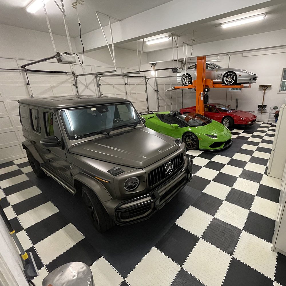 large garage with garage floor tiles in checkerboard black and white pattern