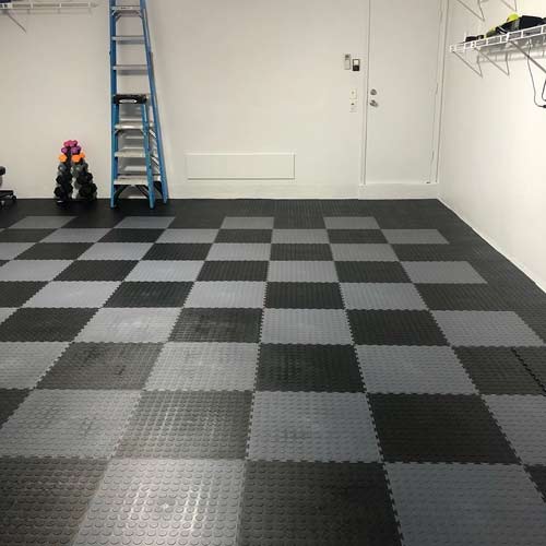 Interlocking floor tiles for snowmobile shed flooring