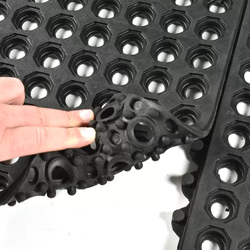 black drainage mat with interlocking puzzle edges