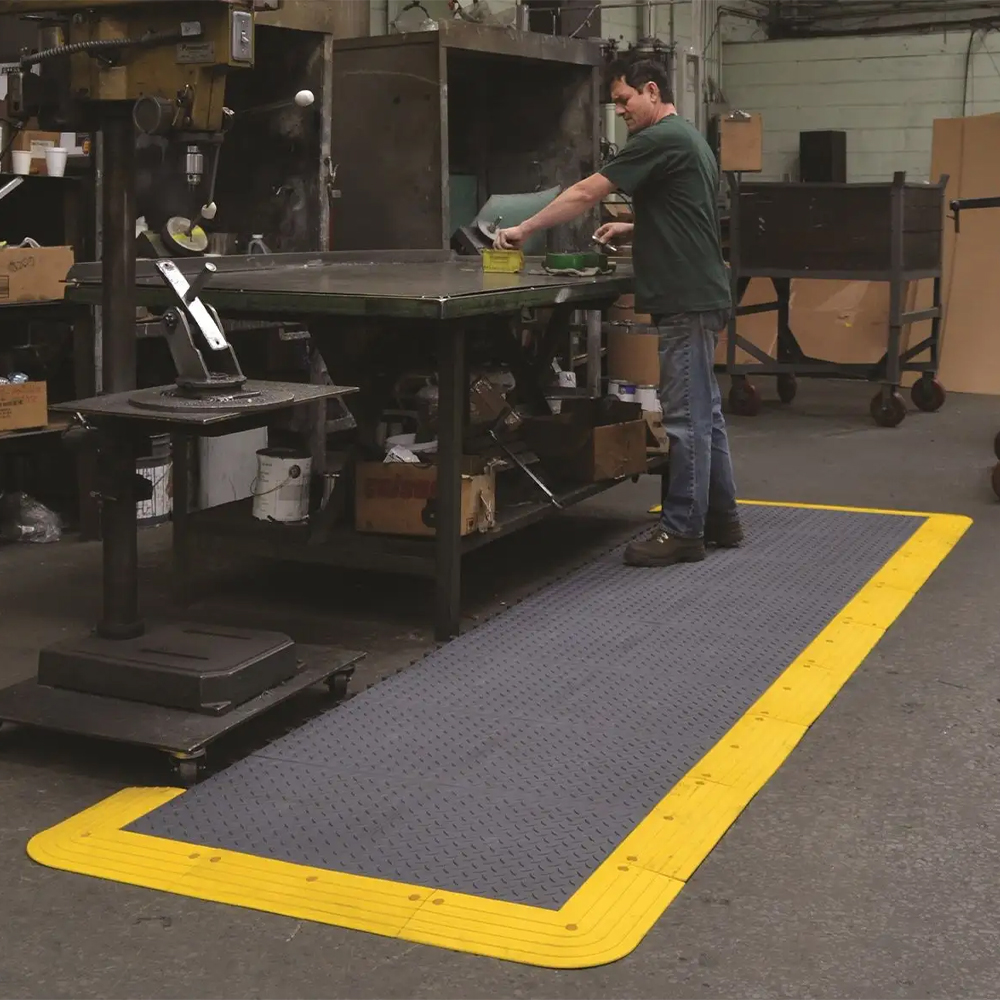 Wearwell ErgoDeck Diamond Plate General Purpose Tile 7/8 Inch x 18x18 Inches Case of 10 in Charcoal at assembly station