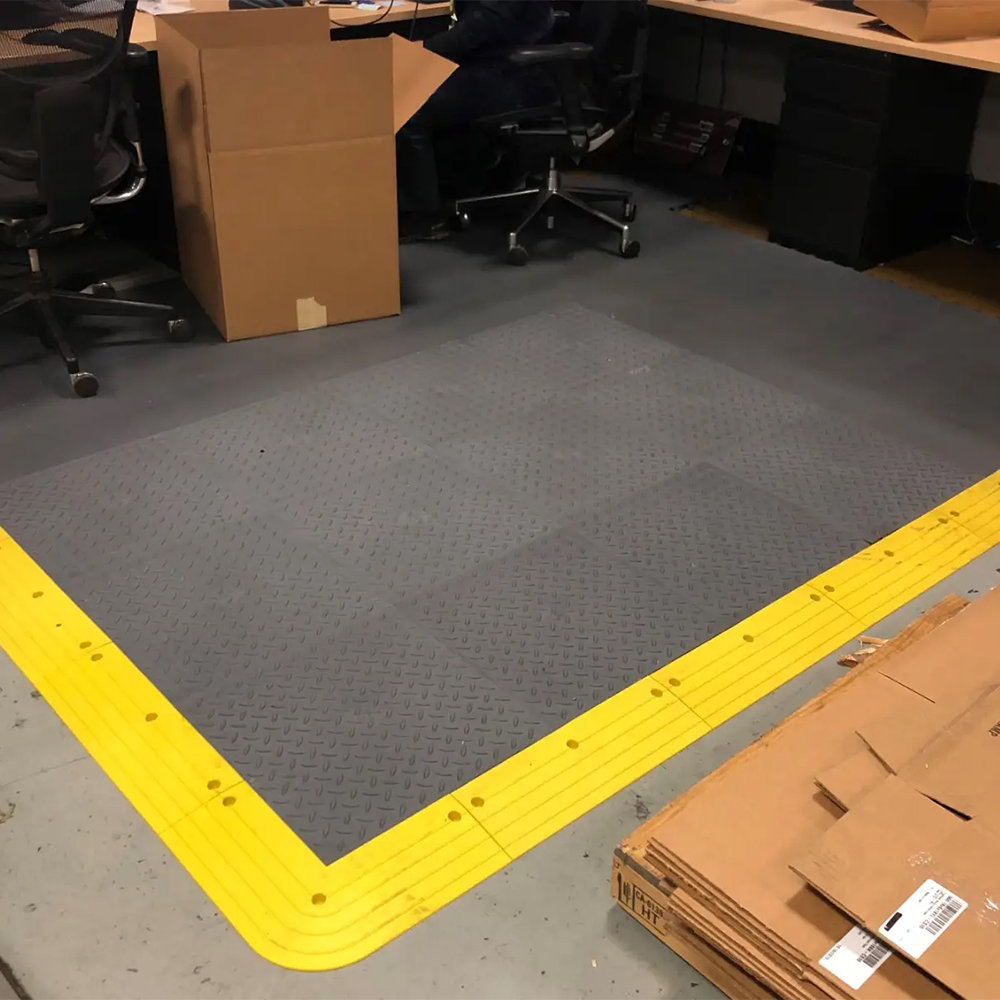 Work area with Wearwell ErgoDeck Diamond Plate General Purpose Tile 7/8 Inch x 18x18 Inches Case of 10 and Smooth Top tile